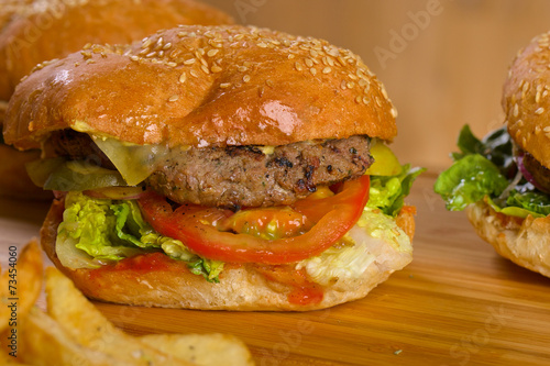 Tasty burger with melted cheese and thick succulent ground beef