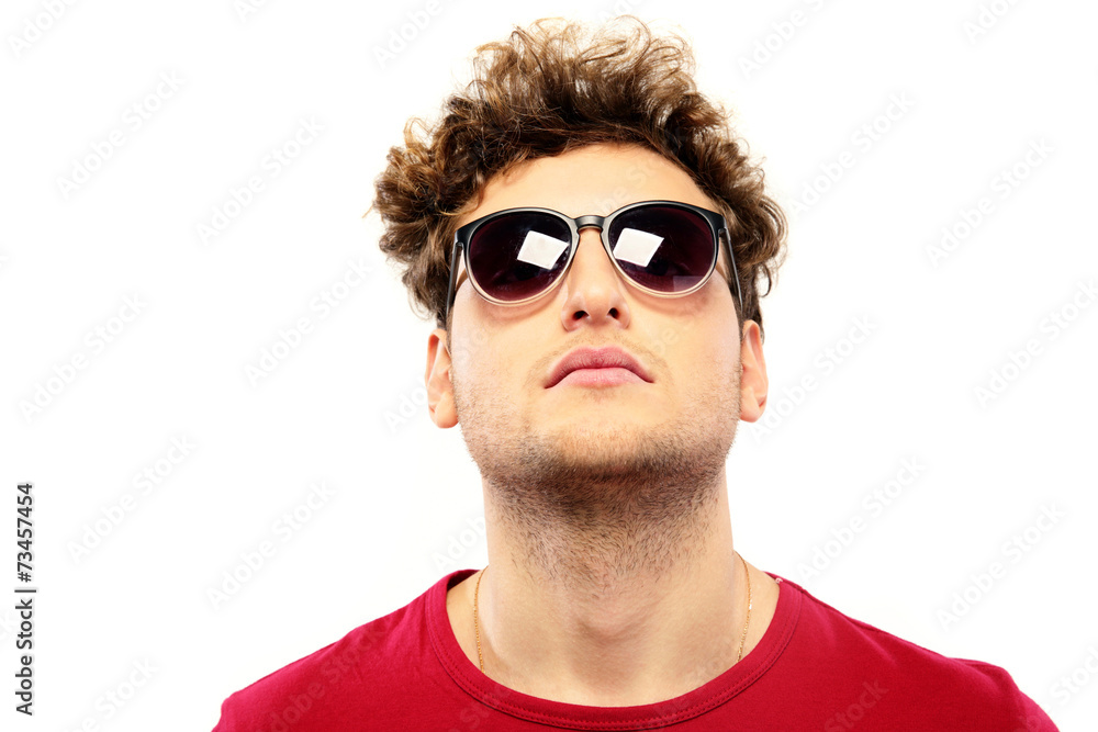Serious man with sunglasses over white background