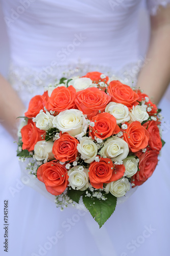 wedding bouquet of white and orange rose