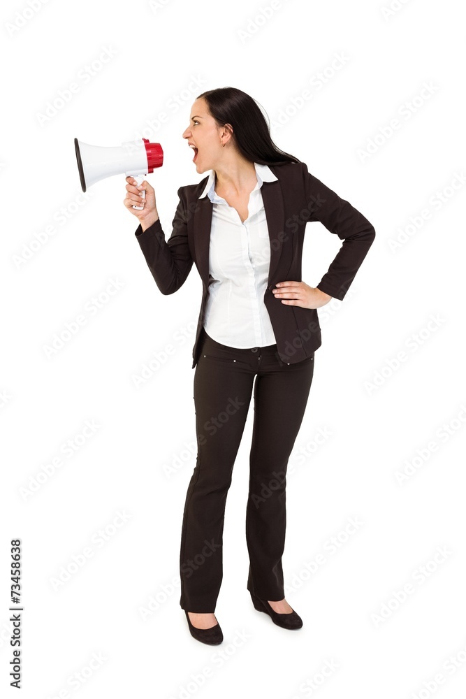 Pretty businesswoman shouting with megaphone Pretty businesswoman shouting with megaphone