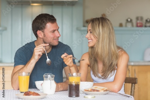 Cute couple having breakfast together