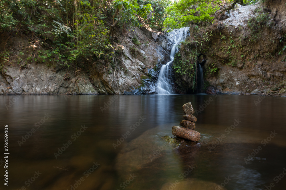 Stone Formation and Waterfall in the distance Stone Formation and Waterfall in the distance