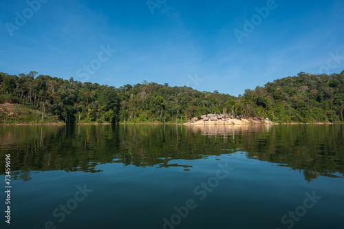Fototapeta Naklejka Na Ścianę i Meble -  Reflection of a village in the middle of a rainforest