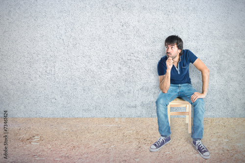 Man thinking over textured background