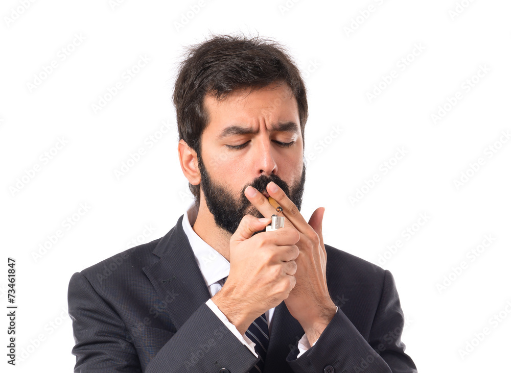 Businessman smoking over isolated white background Businessman smoking over isolated white background