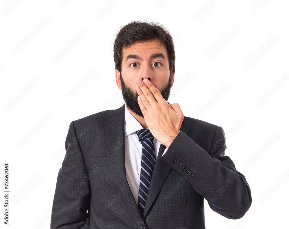 Businessman doing surprise gesture over white background Businessman doing surprise gesture over white background