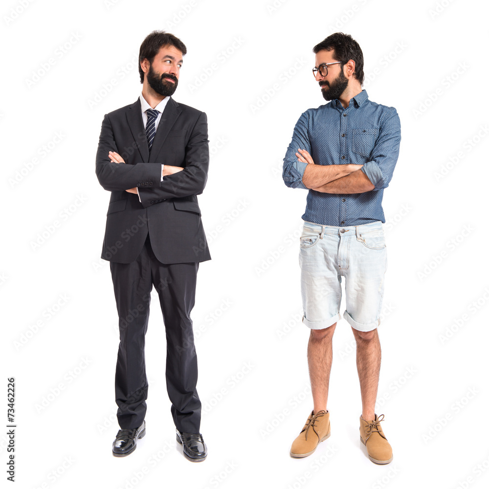 Brothers with his arms crossed over white background Brothers with his arms crossed over white background