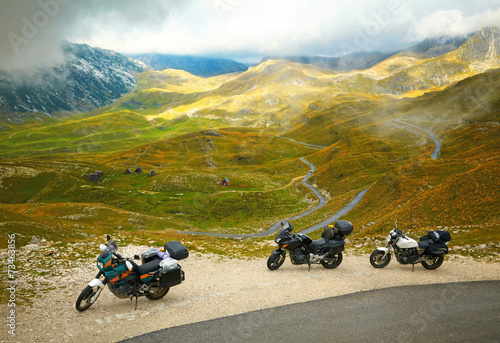 Landscape with mountain road and three motorbikes