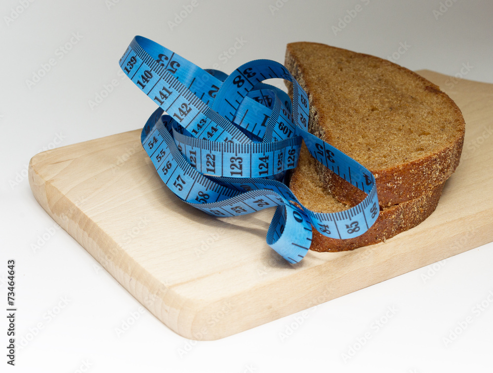 Two pieces of dark bread and blue meter on the board