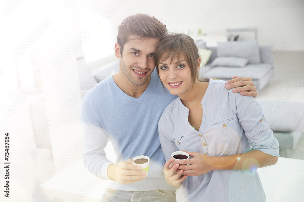 Happy young couple moving together in new apartment Happy young couple moving together in new apartment