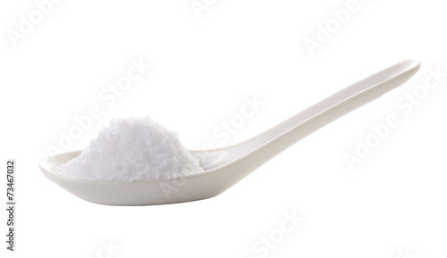 sea salt in spoon on white background