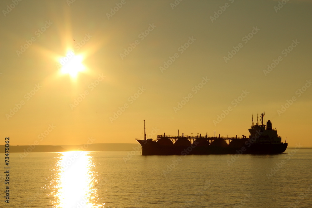silhouette tanker on sunset background