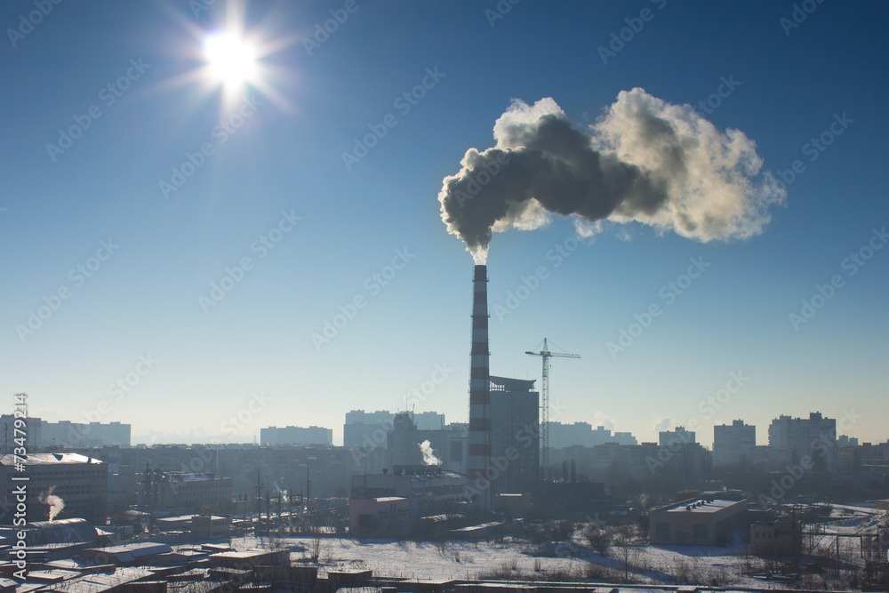 The industrial pipe with smoke, winter