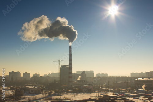 The industrial pipe with smoke  winter