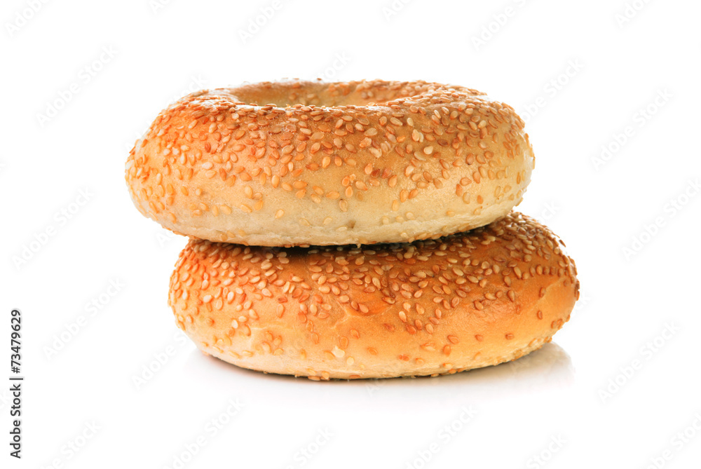 Two Bagels with sesame seeds on white