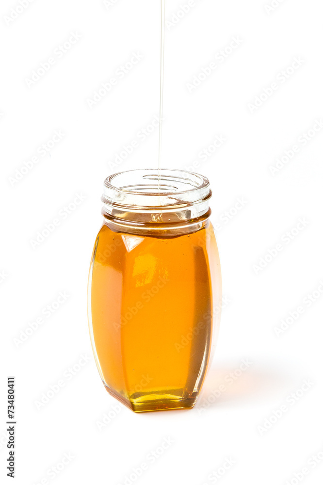 Little bottle filled with honey Little bottle filled with honey