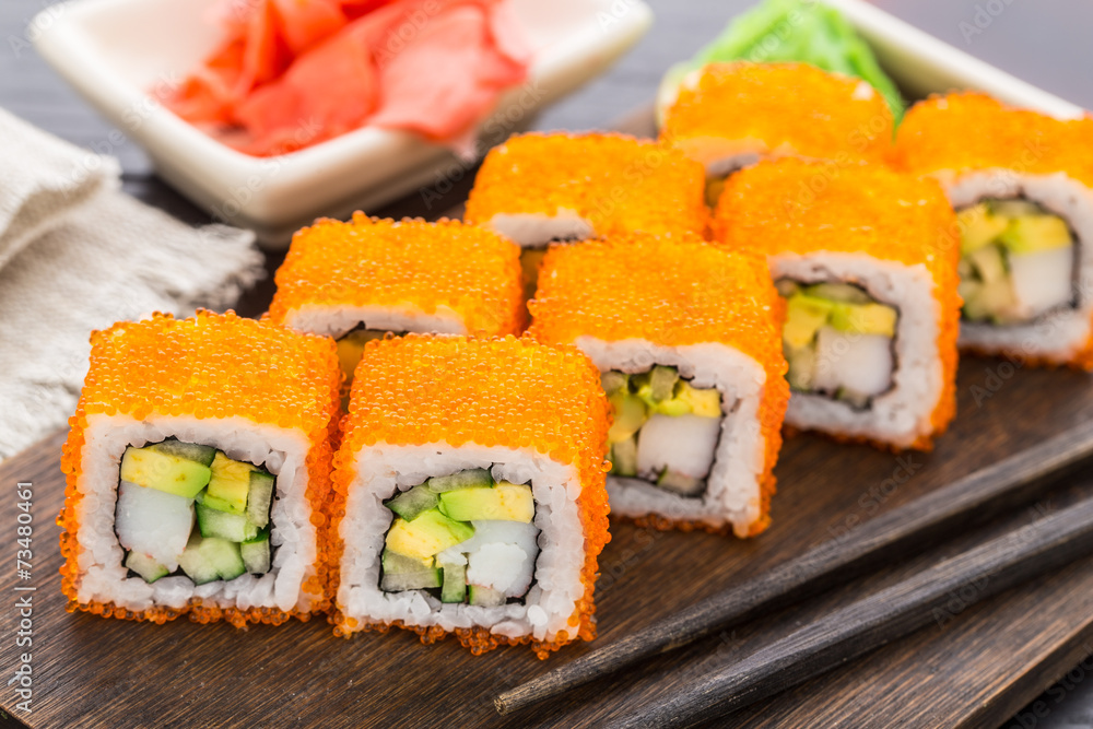 Sushi roll with tobico and avocado Sushi roll with tobico and avocado