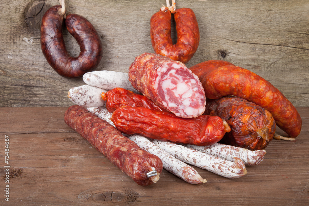 Fototapeta premium several types of sausages on a wooden background