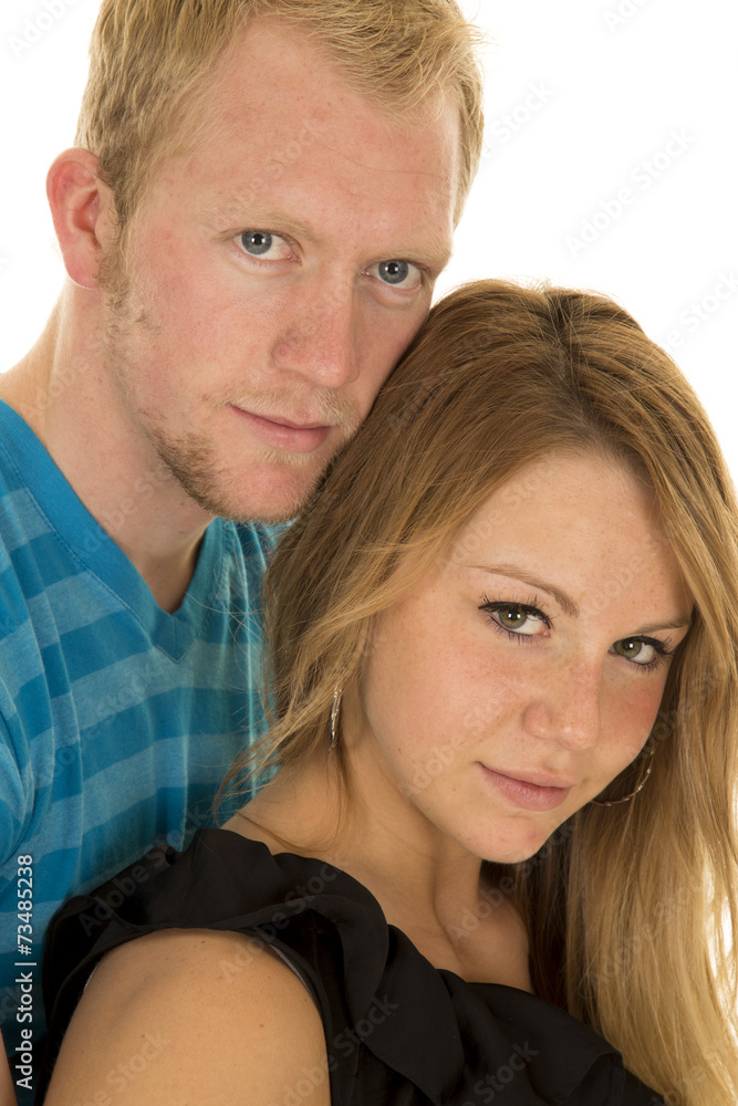 couple man blue shirt heads close looking