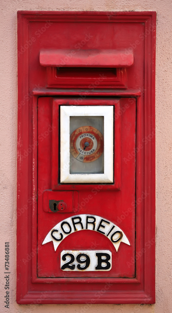 Portuguese red mail box on pink wall. Portuguese red mail box on pink wall.