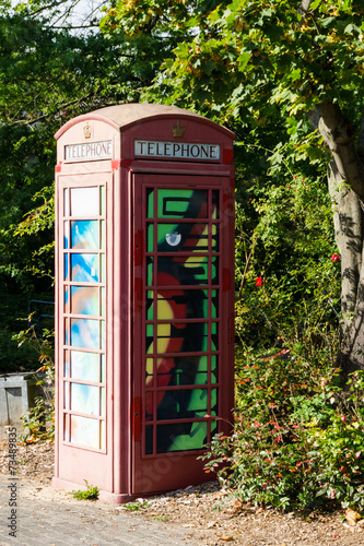 painted old red phone booth  phone box  painted in different col