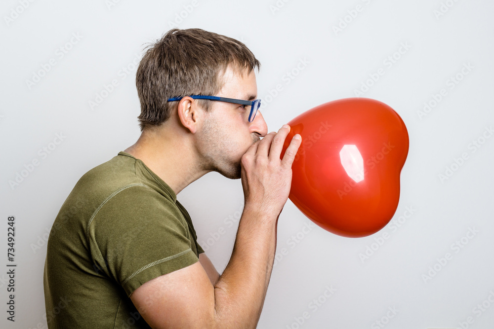 Young Man With Heartshaped Ballon Young Man With Heartshaped Ballon