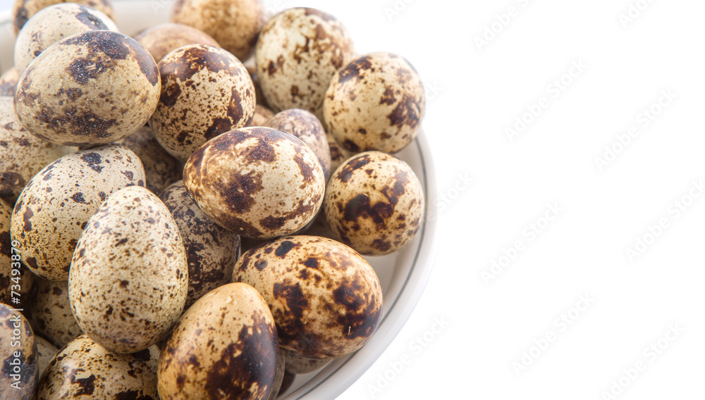 Quail eggs in a white bowl over white background Quail eggs in a white bowl over white background