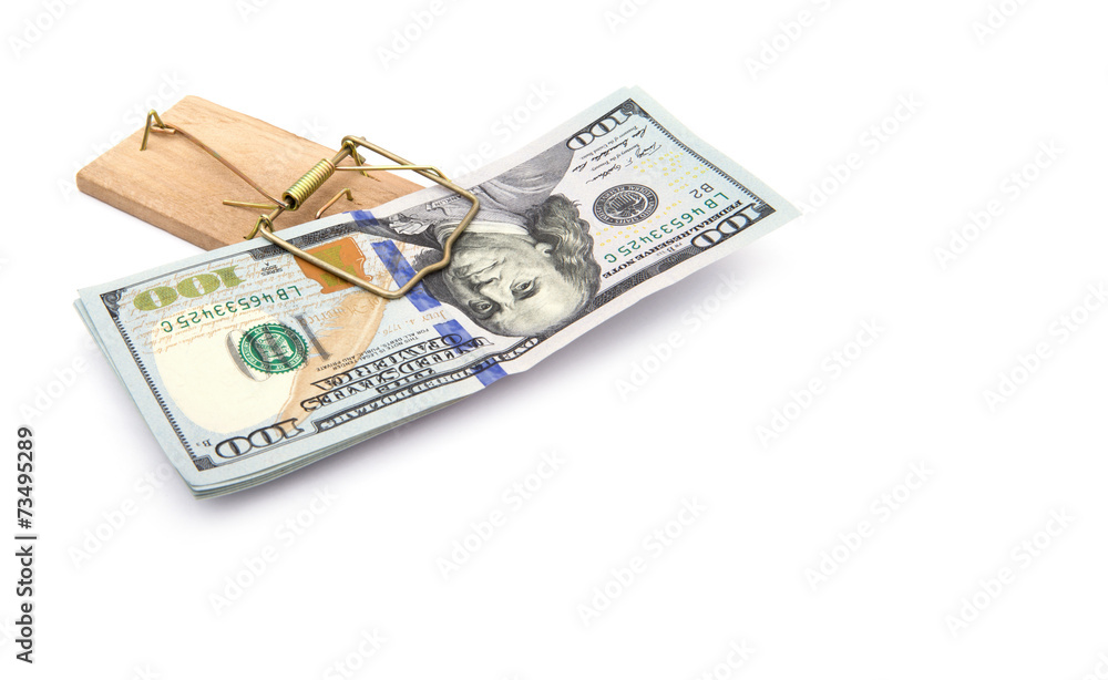 Money in a mousetrap on a white background Money in a mousetrap on a white background