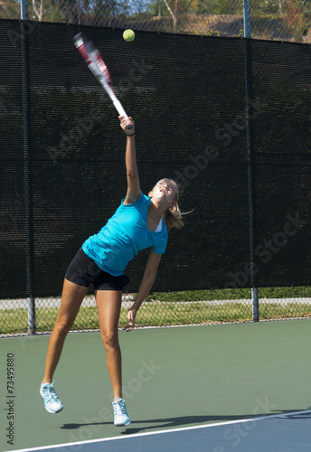 Junior Tennis Player Serving