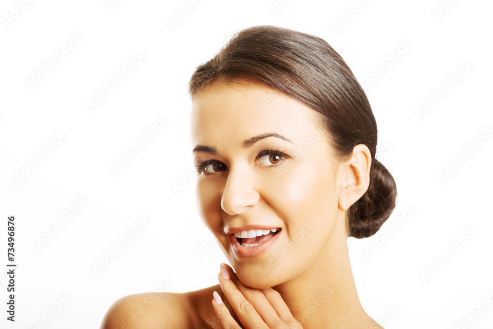 Beautiful nude woman holding hands on chin Beautiful nude woman holding hands on chin