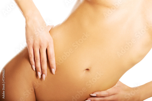 Close up on a perfect slim woman belly
