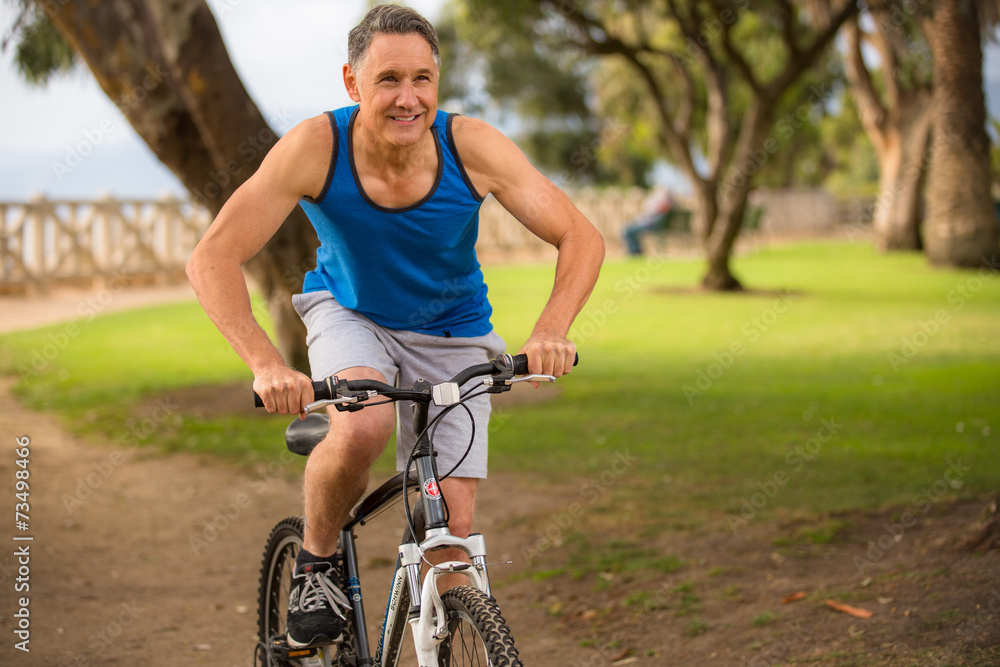 Man riding his mountain bike at the park Man riding his mountain bike at the park
