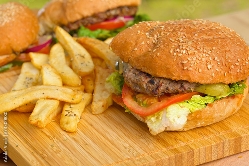 Tasty burger with melted cheese and thick succulent ground beef