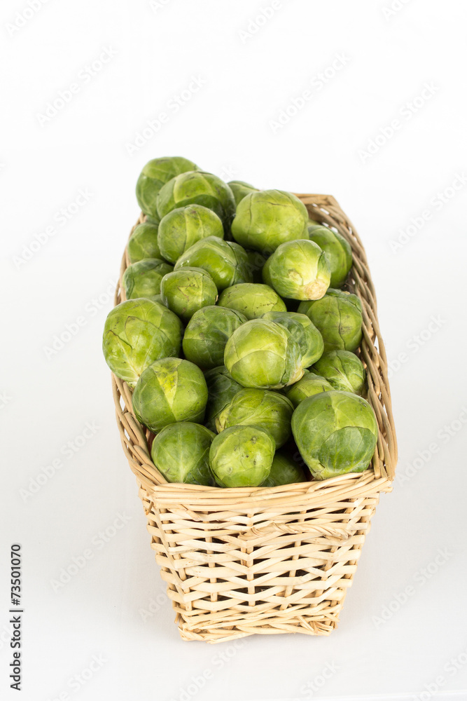 Basket full of brussel sprouts isolated on white Basket full of brussel sprouts isolated on white