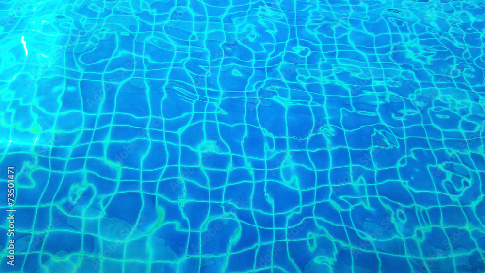 water with sun reflections in swim pool