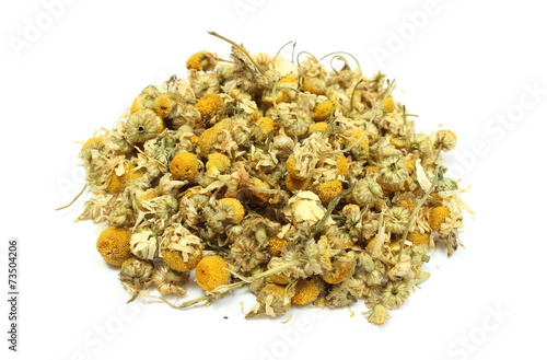 Heap of dried chamomile on white background