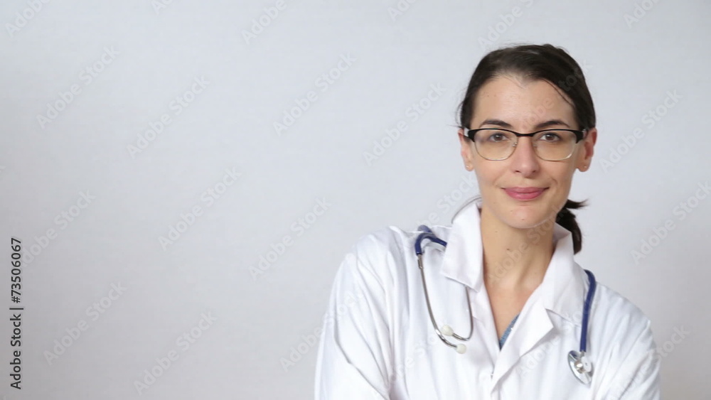 attractive female doctor looking straight at the camera attractive female doctor looking straight at the camera