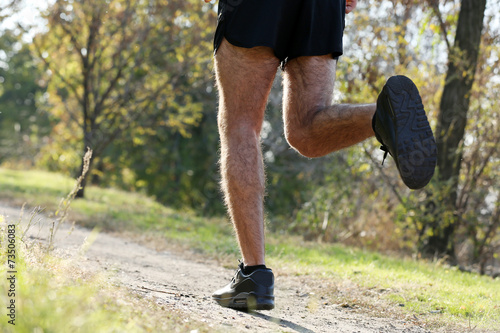 Young man jogging at park