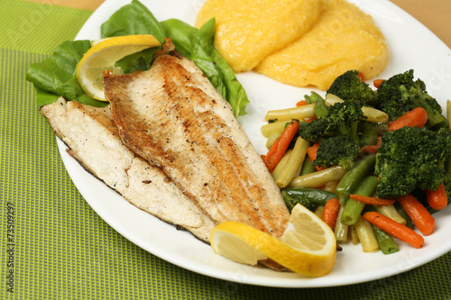 Tasty fish with lemon and vegetables