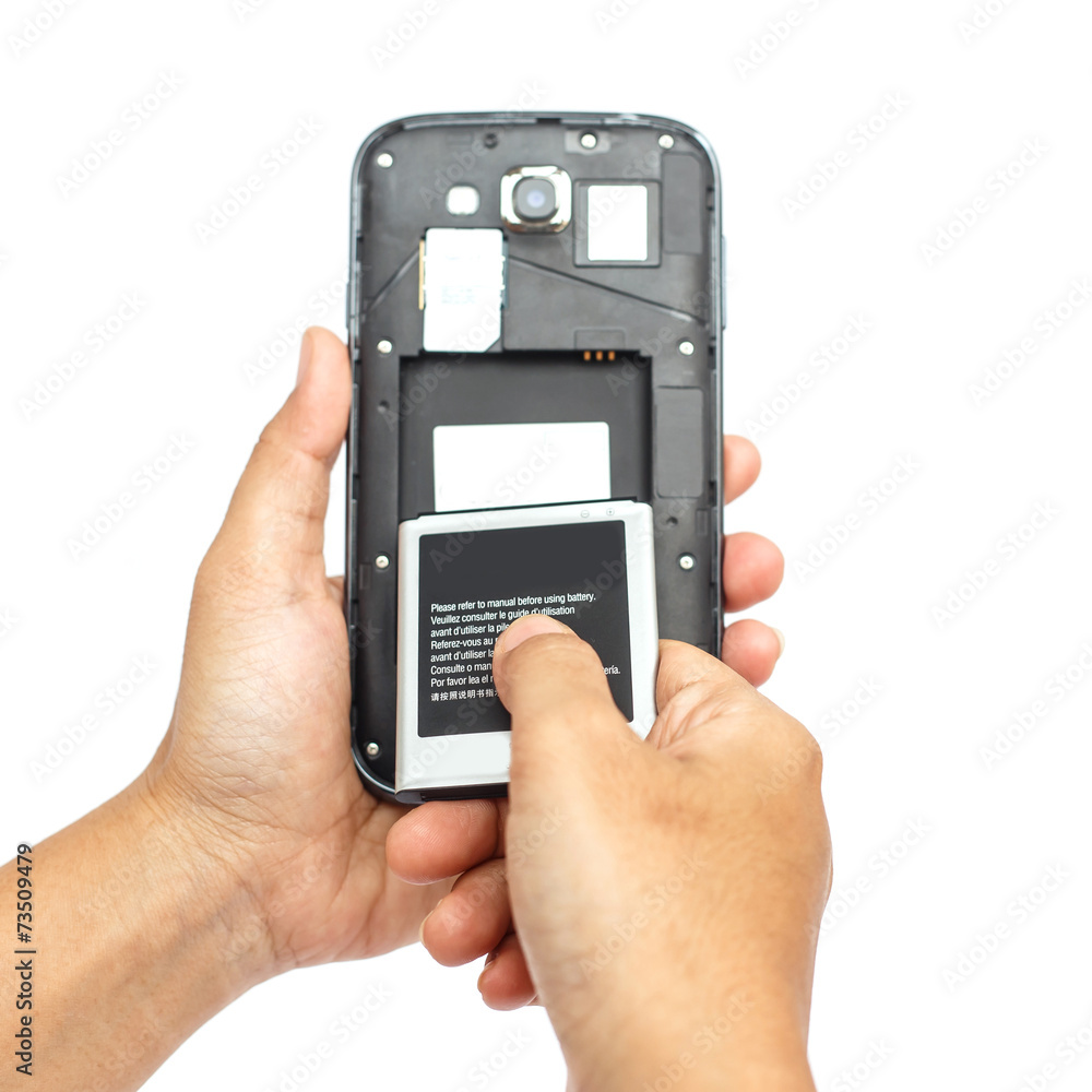 Hand holding battery of smartphone isolated on white background Hand holding battery of smartphone isolated on white background