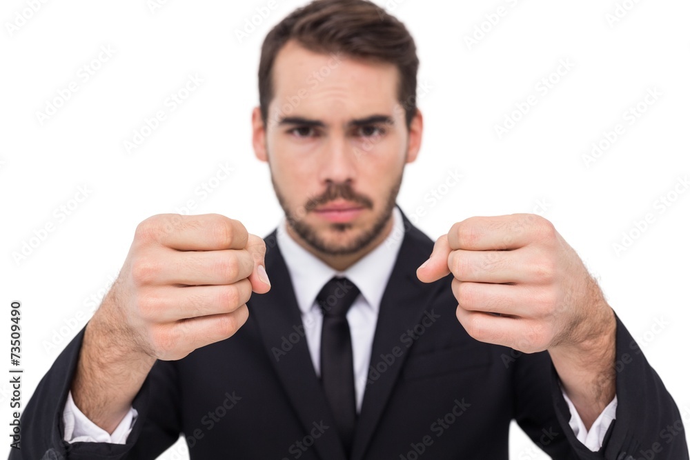 Exasperated businessman with clenched fists Exasperated businessman with clenched fists