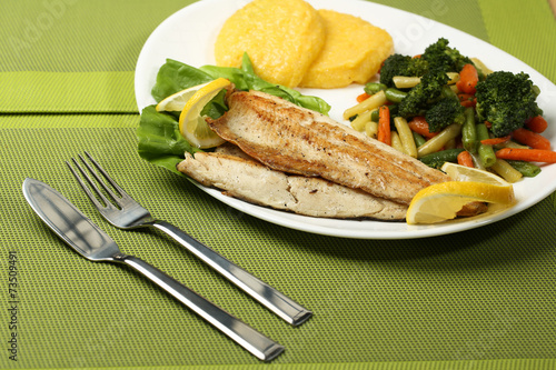 Tasty fish with lemon and vegetables