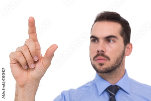 Businessman measuring something with his fingers