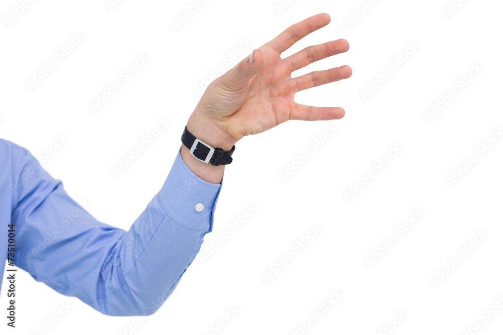 Fototapeta premium Businessman holding hand out in presentation