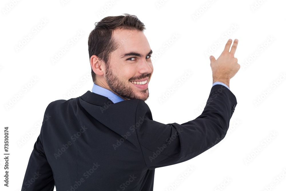 Smiling businessman pointing these fingers Smiling businessman pointing these fingers