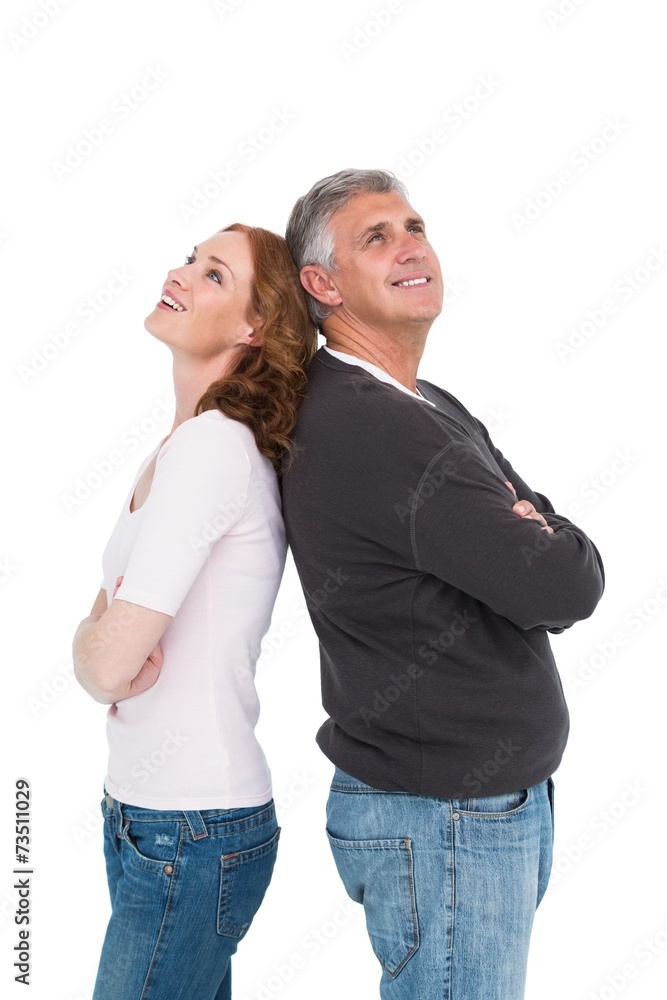 Casual couple smiling and looking up