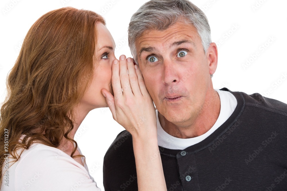 Woman telling secret to her partner Woman telling secret to her partner