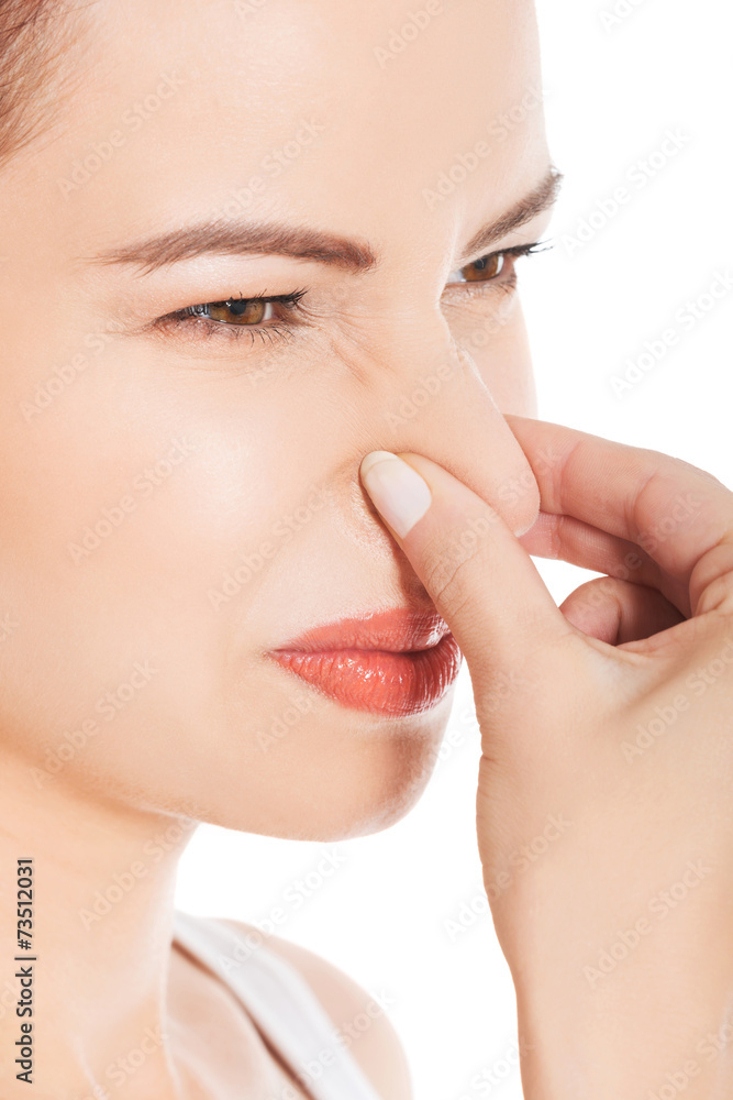 Portrait of a woman clogging nose