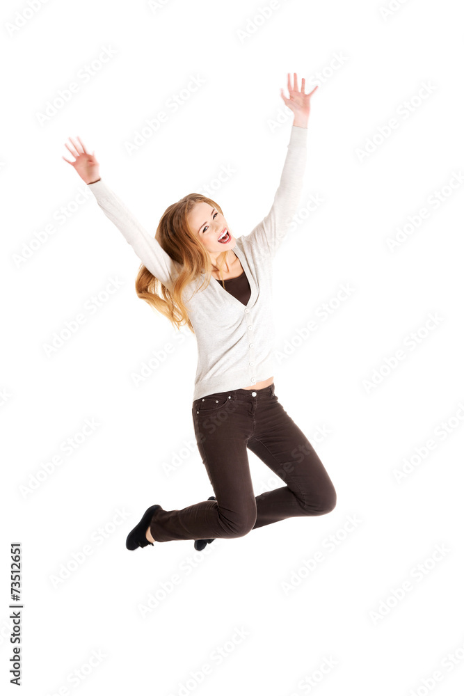 Full length young woman jumping