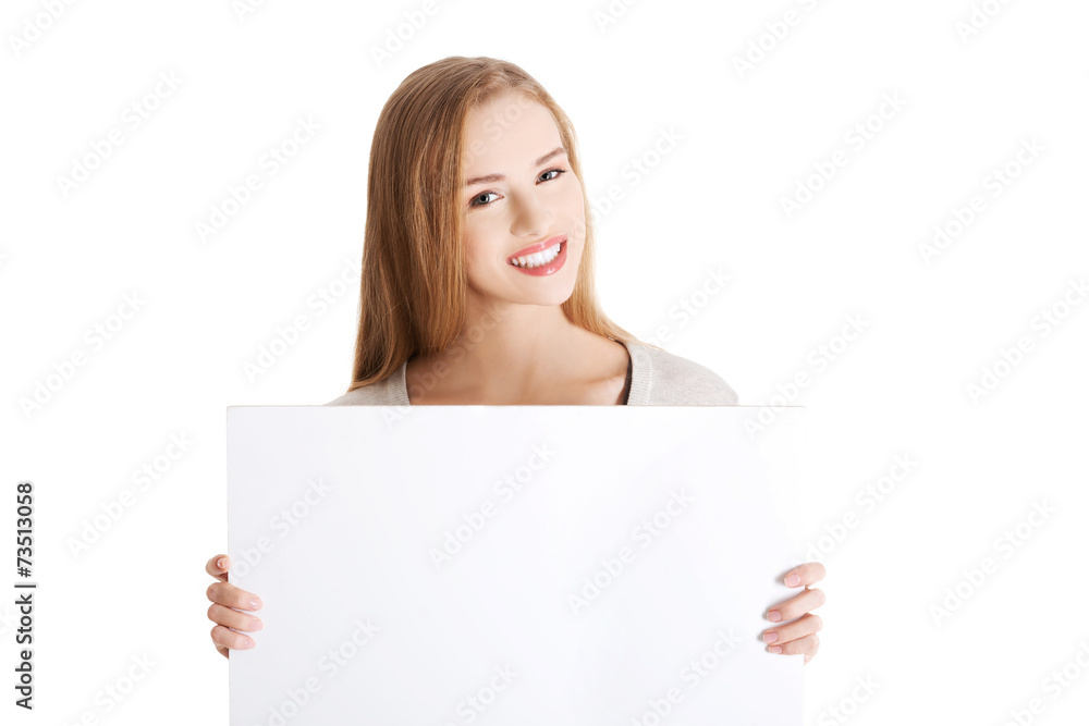 Portait of happy woman holding an empty baner Portait of happy woman holding an empty baner